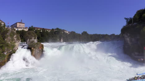 approaching shot over the roaring waterfall rheinfall schaffhausen in switzerland