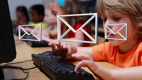 envelope animation over young boy on computer.