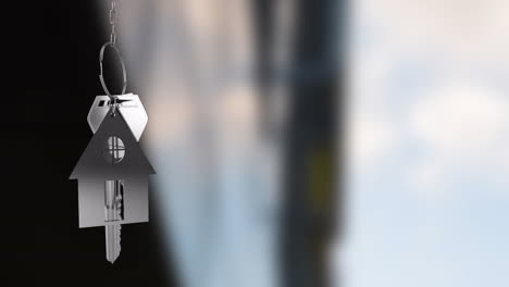 house-shaped keychain animation over blurred background