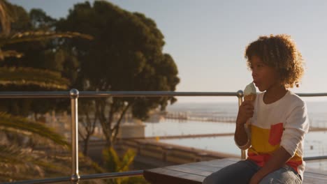 mother and son eating ice cream and using phone