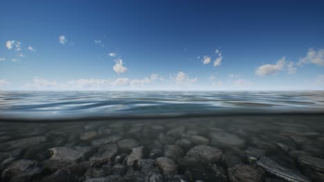 ocean seascape with sky and ocean wave splitted by waterline to underwater part