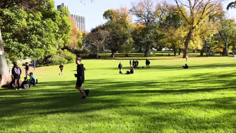 child running through a sunny park