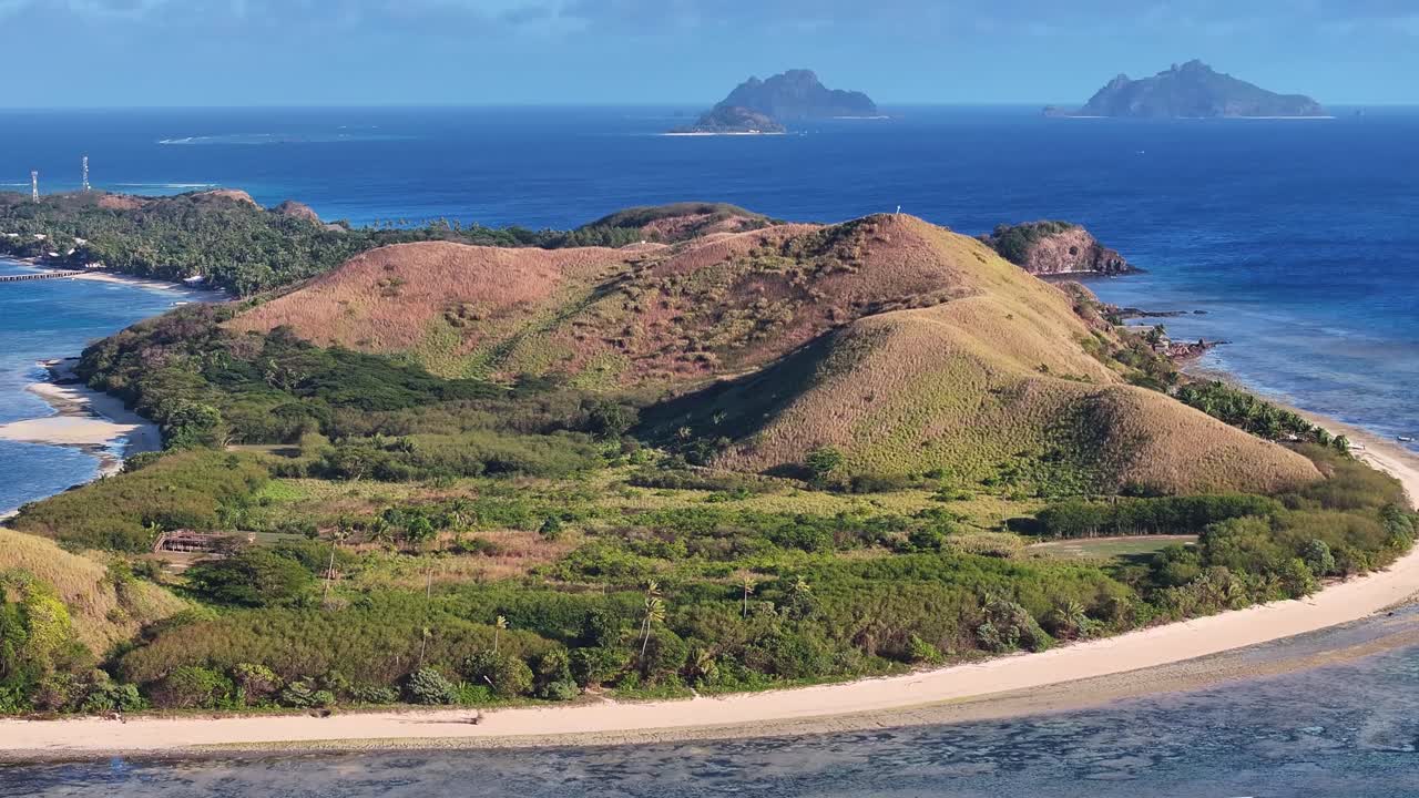 Mana Island, Fiji. Scenic view of Pacific tropical island, long beach, crystal clear waters.