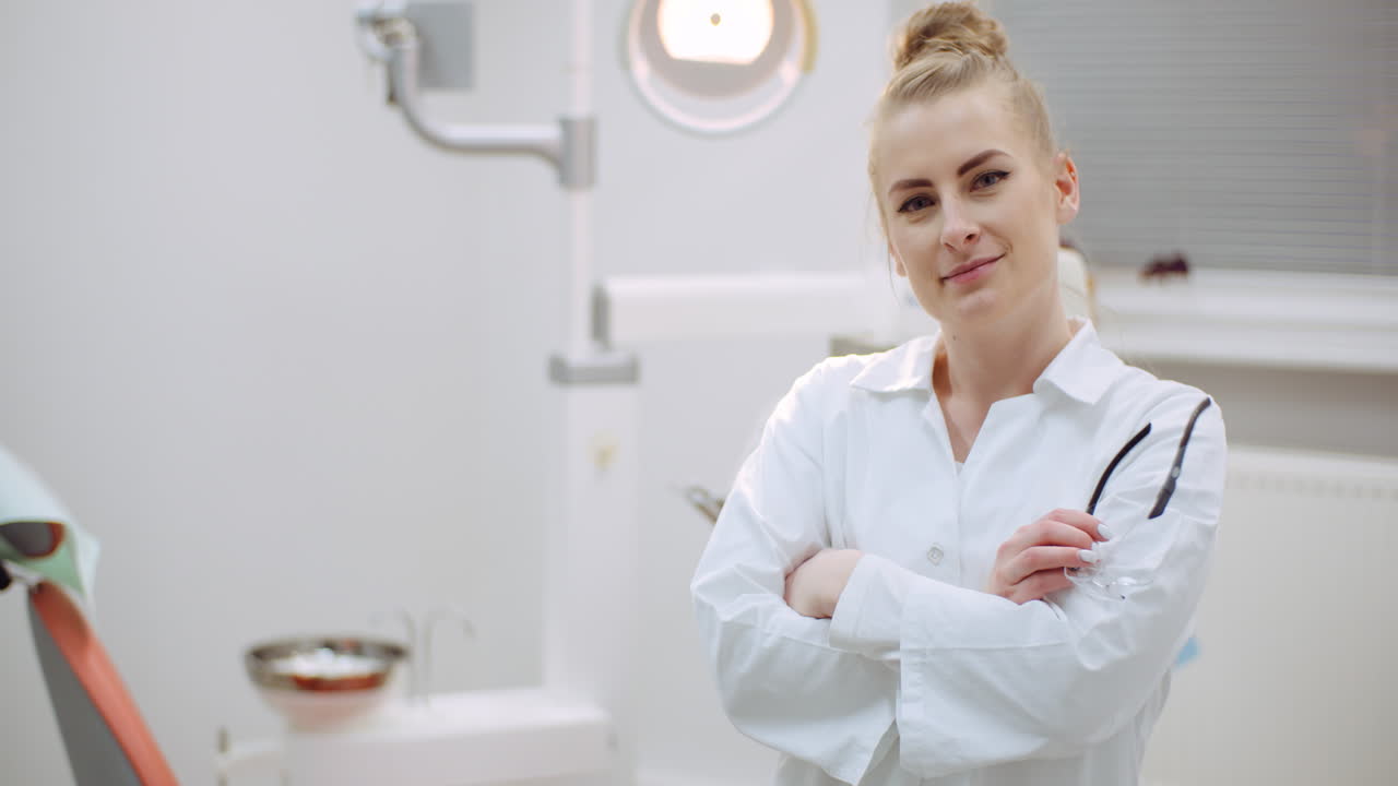 Young Positive Female Dentist Smiling At Dental Clinic 3