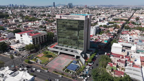 aerial view of the rectoria building in guadalajara, jalisco, mexico, with the traffic of the enrique diaz de leon and vallarta avenues