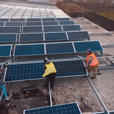 workers installing solar panels outdoors