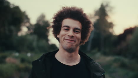 portrait of a smiling man in a park