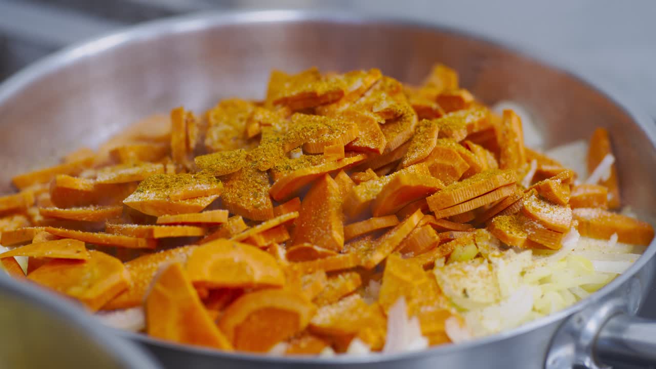 Cooking Carrots and Onions in a Pan