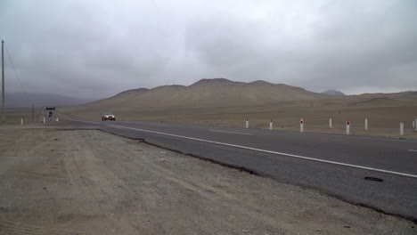 an approaching vehicle on a rural highway in gramita, casma, ancash, peru, south america