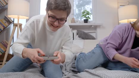 mother and daughter playing retro video games