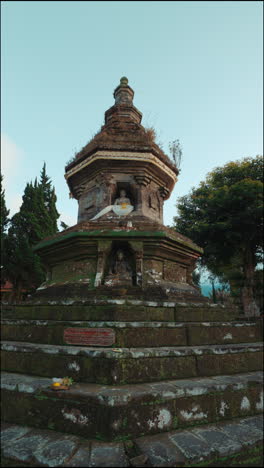 ancient stone stupa with buddha statues in a serene landscape