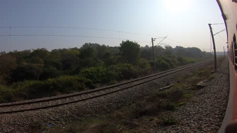 train window leaning out point of view during long distance train ride travel, indian railways