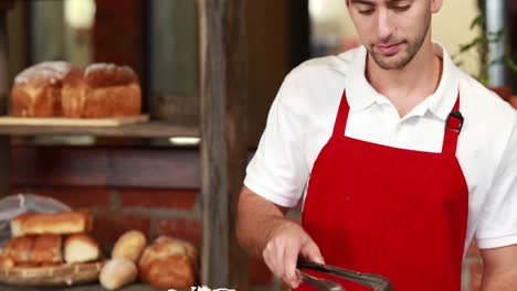 Smiling-waiter-with-arms-crossed