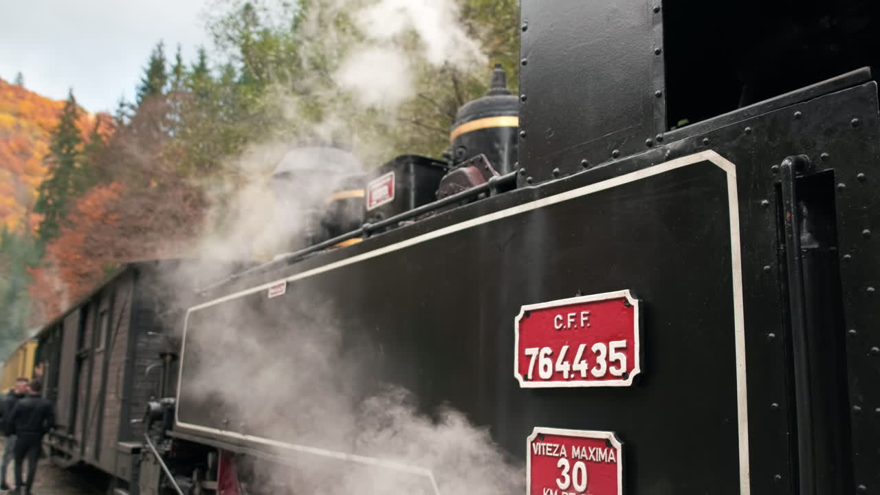 View of the wound-up steam train Mocanita on a railway station, Romania