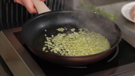 cooking onions in a pan