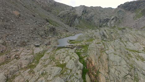 birdseye view of mountain lake in summer season at campagneda in valmalenco of valtellina region in italy