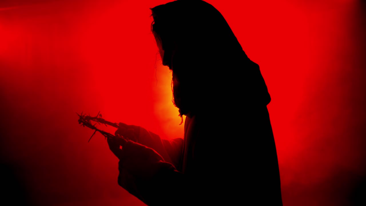 Jesus Christ holding a crown of thorns for Christianity, Easter visual, bible scene or temptation, prayer, worship visual.