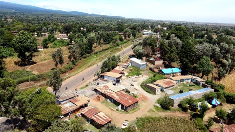 aerial drone view open air market in the loitokitok town, kenya and mount kilimanjaro- rural village of kenya