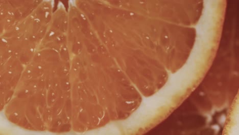 micro vídeo de primer plano de rebanadas de naranja con espacio de copia