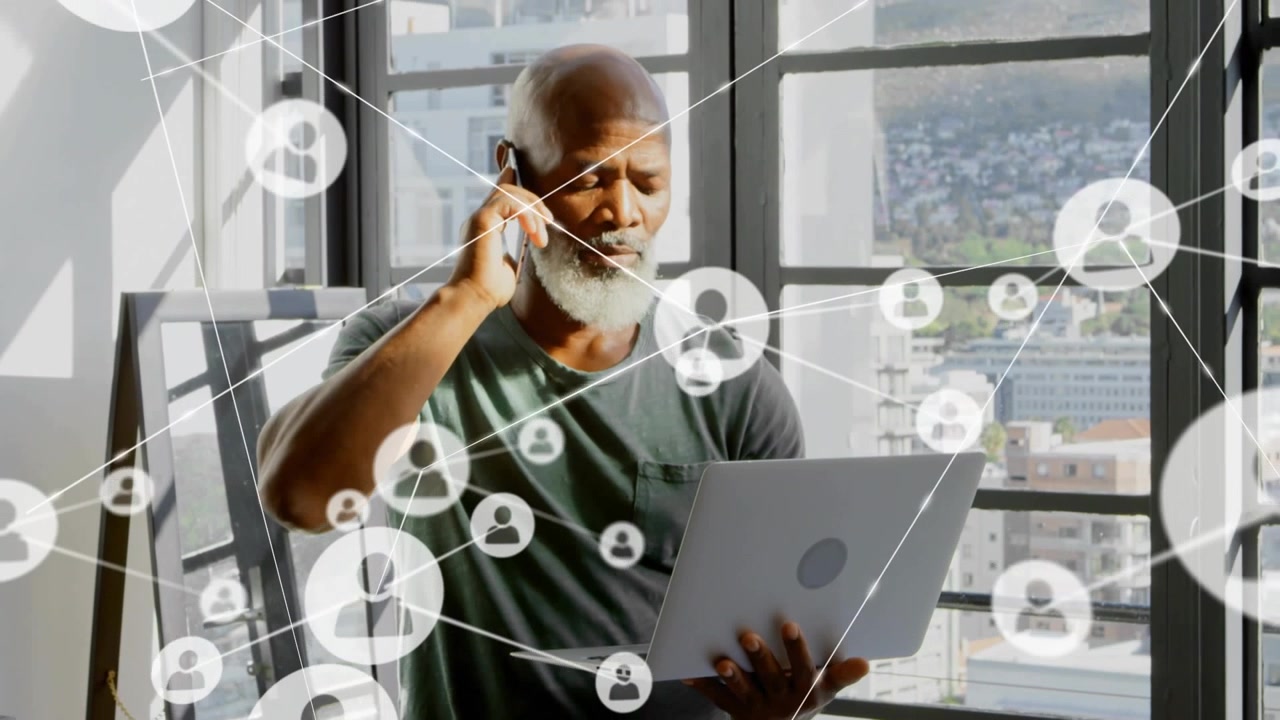 Man holding laptop and phone, user icon appearing, spawning tech net lines around man showing links