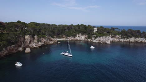 yachts in hidden cove beach on cannes and antibes coastline, aerial