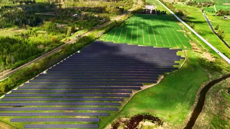 cloud shadow over solar farm during summertime. timelapse