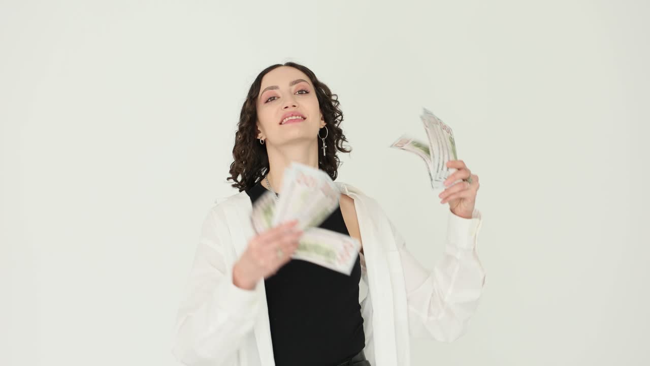 Woman celebrating financial success with money