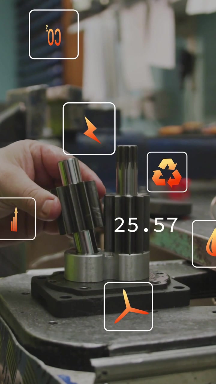 Vertical video: Tech hand entering, assembling splined gears in machine shop, eco icons appearing