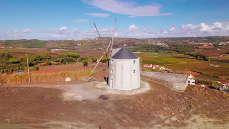 Aerial-view-of-windmill-in-Fernandinho,-Torres-Vedras,-Portugal
