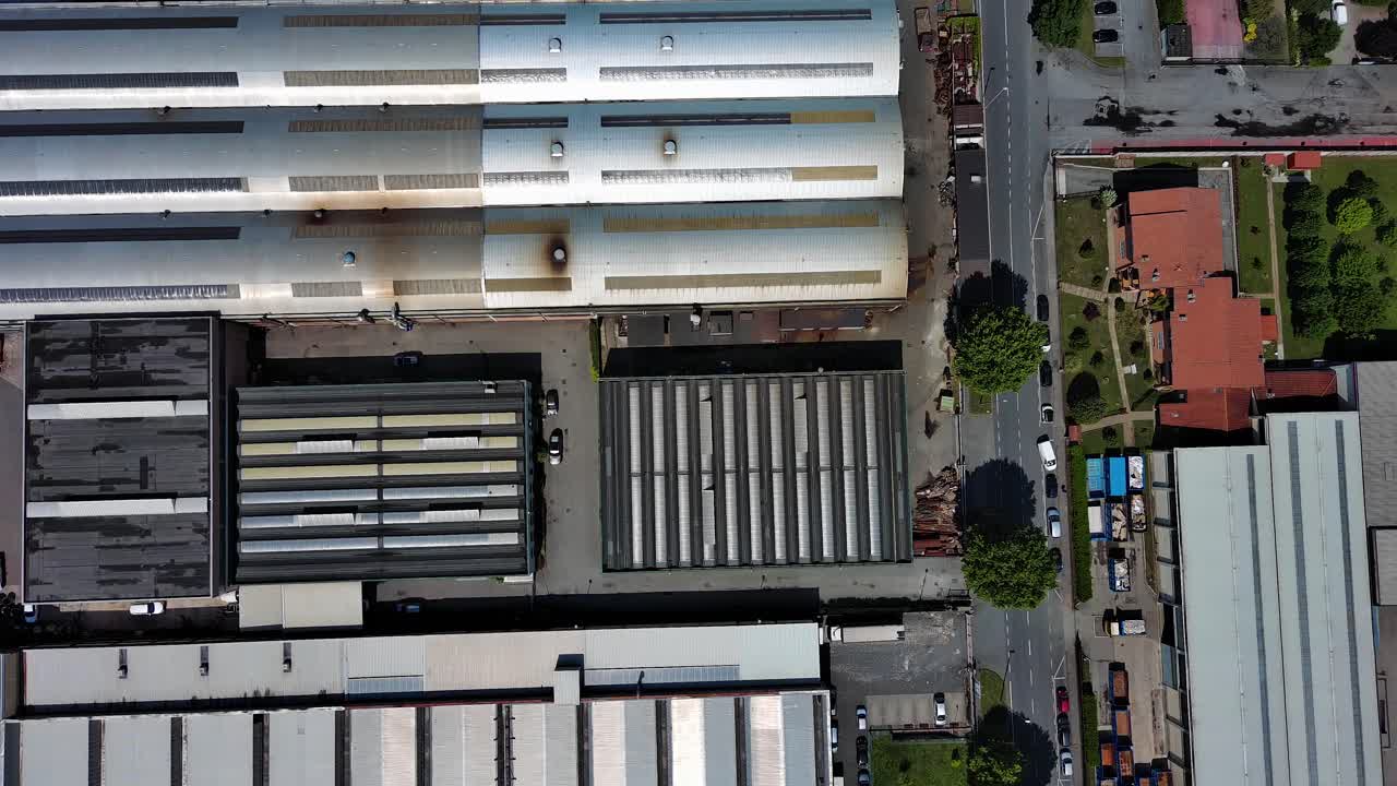Aerial top down of logistic factory import export warehouse with truck