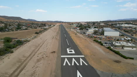 drone shot of a rural desert airport runway