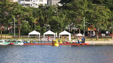 pedal boats moving along a serene lake