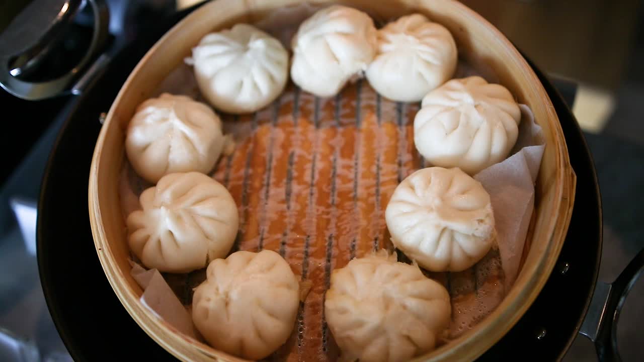 White Asian dumplings in round basket