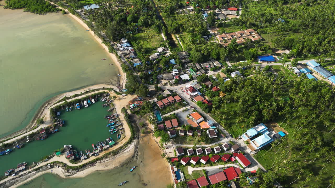 Wok Tum Canel for boats in shallow bay water, aerial orbit view