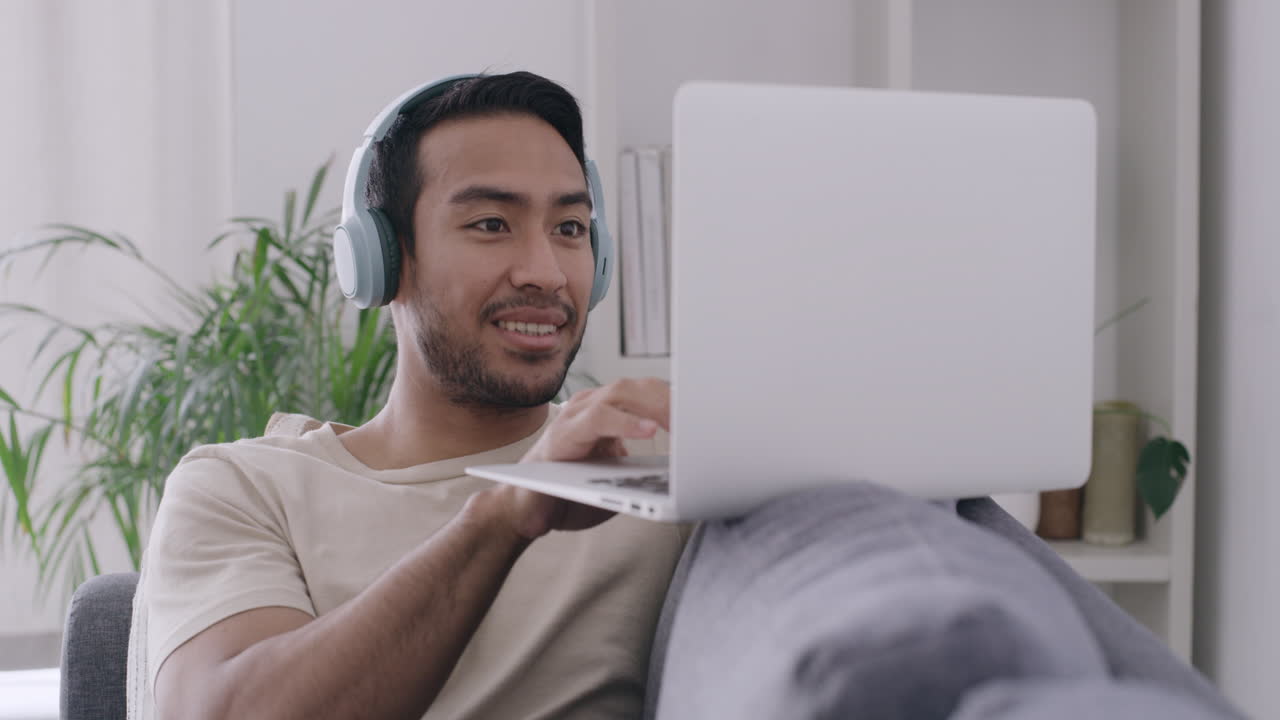 Music dj streaming on a laptop through headphones