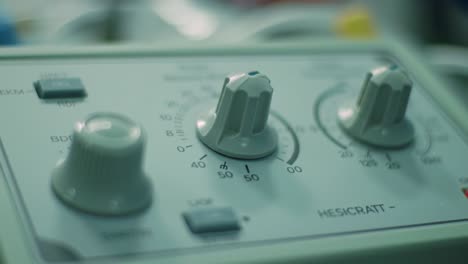 various dials and controls are adjusted carefully in a laboratory, emphasizing the importance of precise measurements for experiments. each setting plays a crucial role in data accuracy.