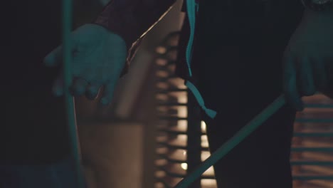 two musicians playing drums in a dark club