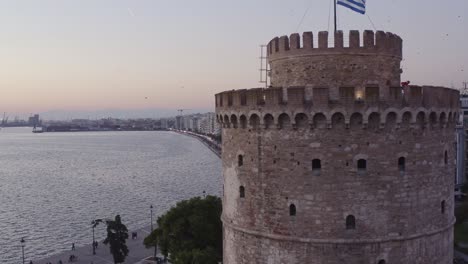 aerial - white tower of thessaloniki with a street