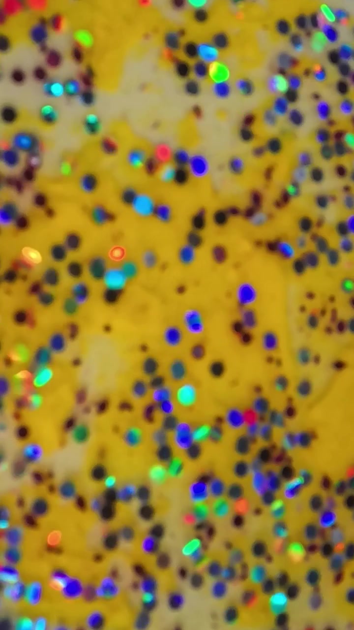 Primo piano di sfondo giallo glitterato