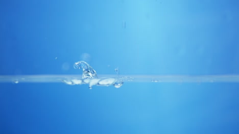 movement of a drop falling on a liquid surface in slow motion