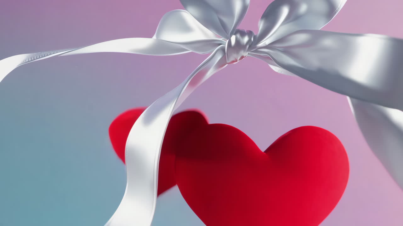 Red Hearts and White Ribbons on a Gradient Background
