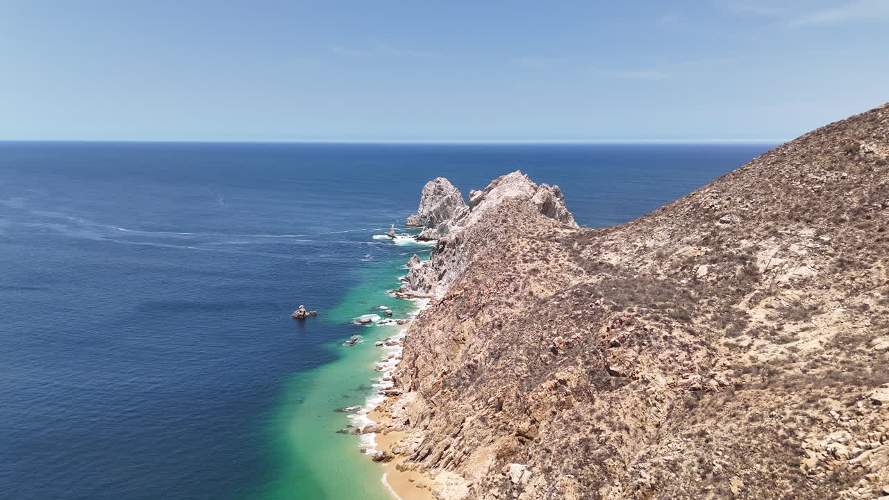 Drone Shot of Scenic Coastline of Cabo San Lucas, Rocky Hills and Ocean Horizon. Baja California Mexico
