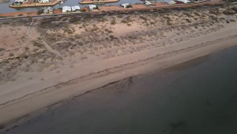 Drone-aerial-over-exmouth-beach-during-sunrise