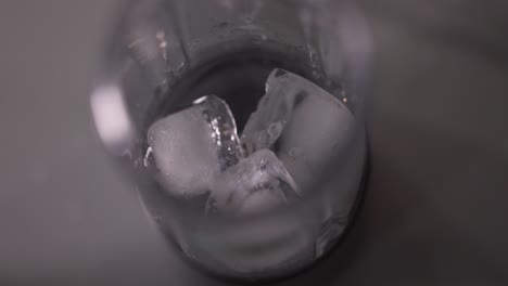 ice cube falling into blender, top view, 4k slow motion