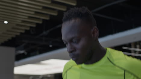 man exercising on treadmill in a gym