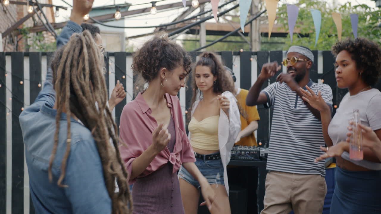 Friends Dancing at an Outdoor Party