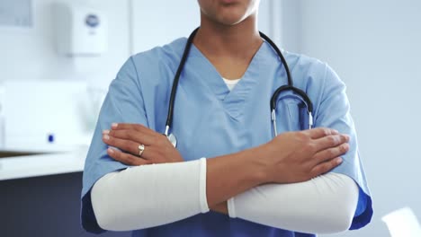 female doctor standing with arms crossed in hospital 4k