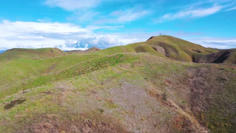 2020---aerial-over-the-pacific-coastal-green-hills-and-mountains-behind-Ventura-California