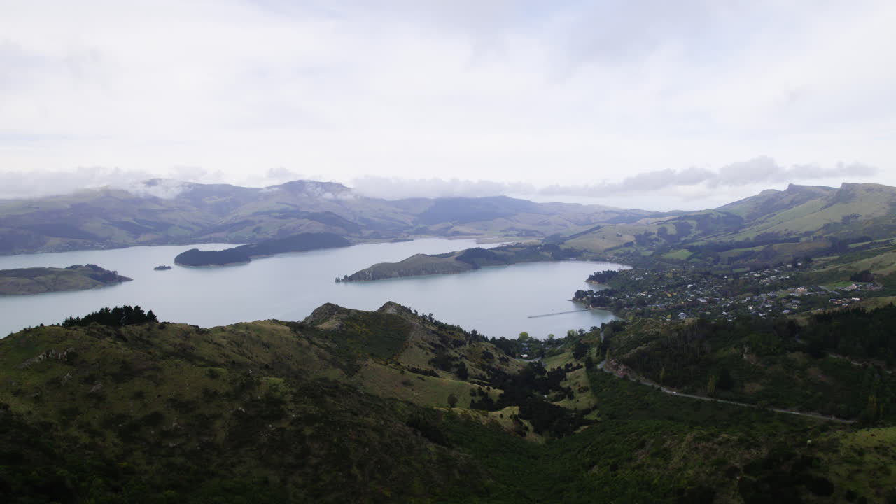 Aerial view approaching the Governors bay in cloudy Canterbury, New Zealand