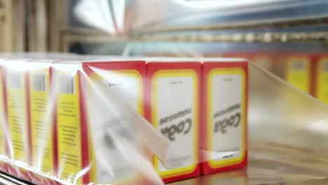 cocoa boxes being packaged on an automated production line